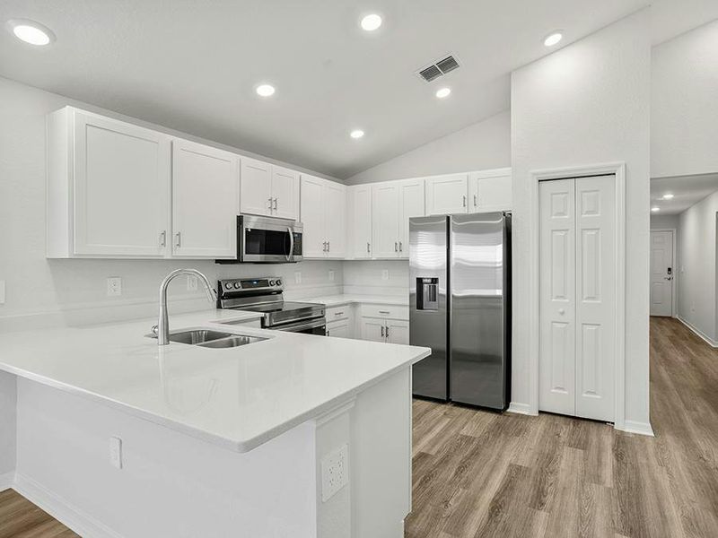 Your bright, beautifully designed kitchen includes quartz, 36-inch cabinets, Samsung SS appliances, and a pantry.