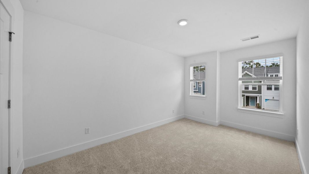 Memorable space with walk-in closet, soft carpeting, and striking natural light from large windows in Spartanburg, SC