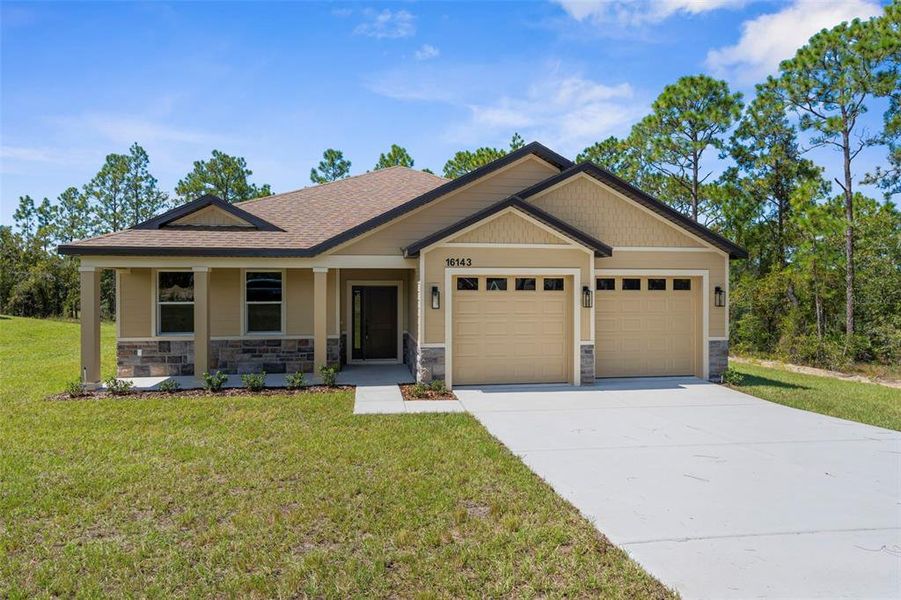 Front exterior of a new home in , Weeki Wachee, FL, highlighting curb appeal (Image 21). Front exterior of a new home in , Weeki Wachee, FL, highlighting curb appeal (Image 21).