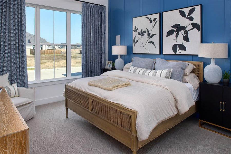 Carpeted bedroom with baseboards