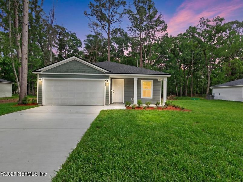 Front exterior of a new home in , Jacksonville, FL, highlighting curb appeal (Image 27).