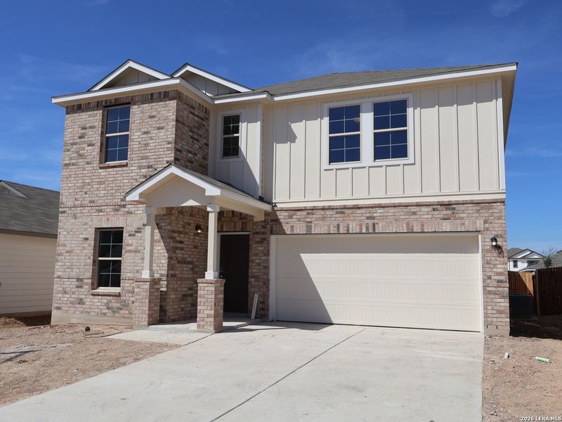 Front exterior of a new home in Meadows at Clear Springs, New Braunfels, TX, highlighting curb appeal (Image 2). Front exterior of a new home in Meadows at Clear Springs, New Braunfels, TX, highlighting curb appeal (Image 2).