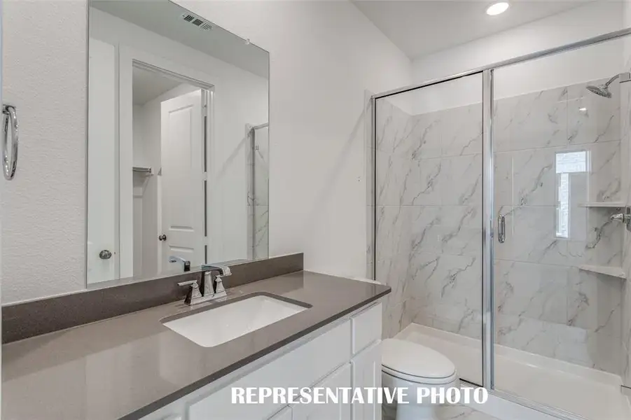Guests will love getting ready in any of the gorgeous guest baths featured in this outstanding home!  REPRESENTATIVE PHOTO