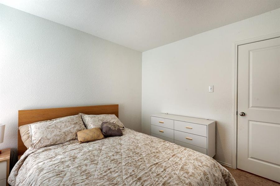 Bedroom featuring carpet floors