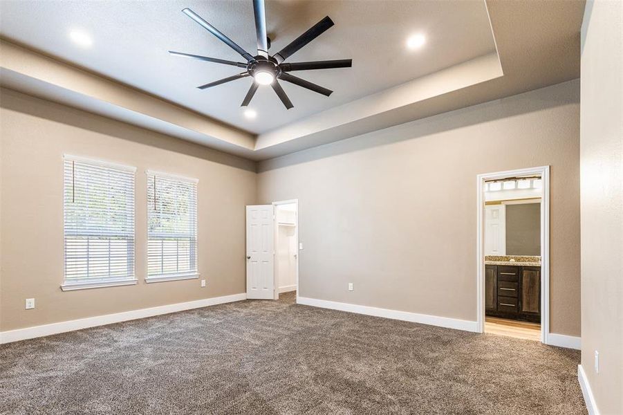 Tall, well appointed primary suite with USB integrated outlets