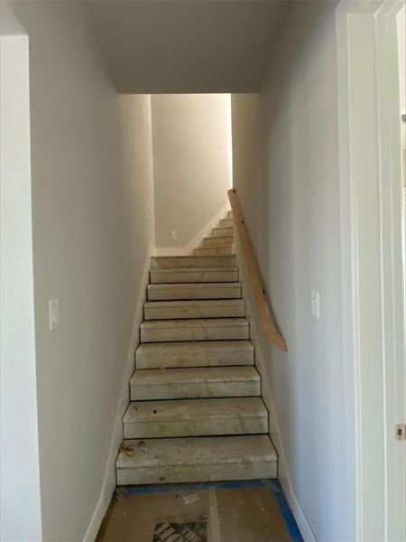 Stairway featuring baseboards Stairway featuring baseboards