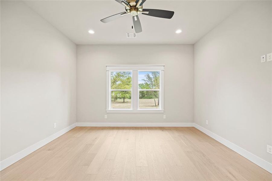 Spare room featuring light wood-type flooring, recessed lighting, and ceiling fan Spare room featuring light wood-type flooring, recessed lighting, and ceiling fan