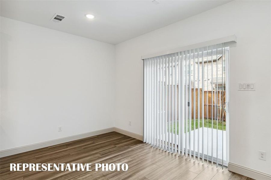 Your new dining room features a sliding glass door that leads out to the patio with fenced back yard!  REPRESENTATIVE PHOTO