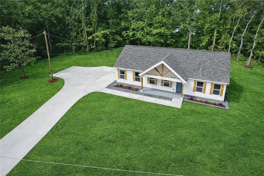 Front exterior of a new home in , Dallas, GA, highlighting curb appeal (Image 19).