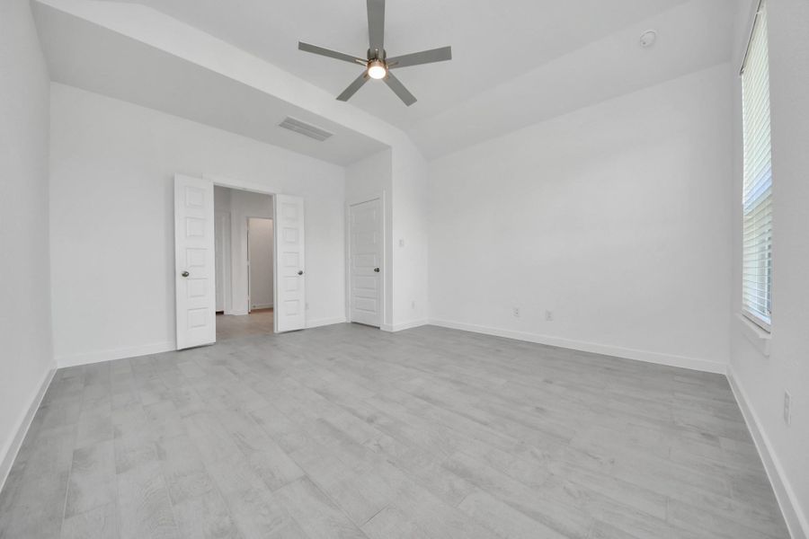 Another perspective unveils a comprehensive view of the serenity and comfort this primary suite offers