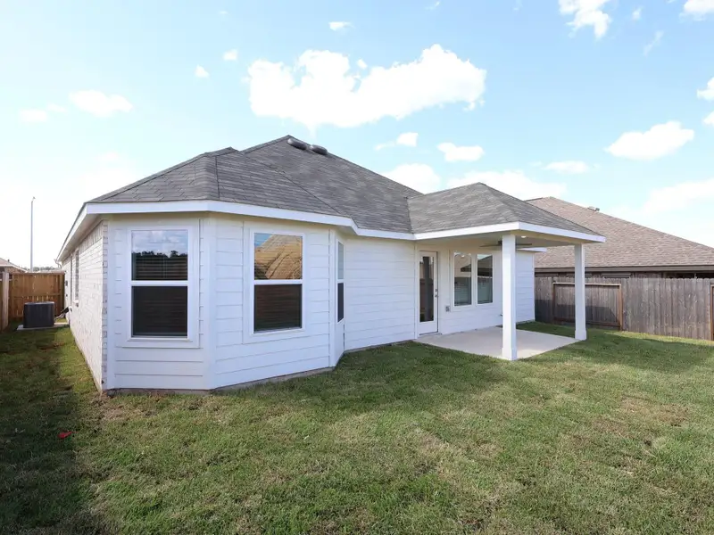 Exterior details and patio area of a home in Magnolia Ridge, Magnolia (Image 4).