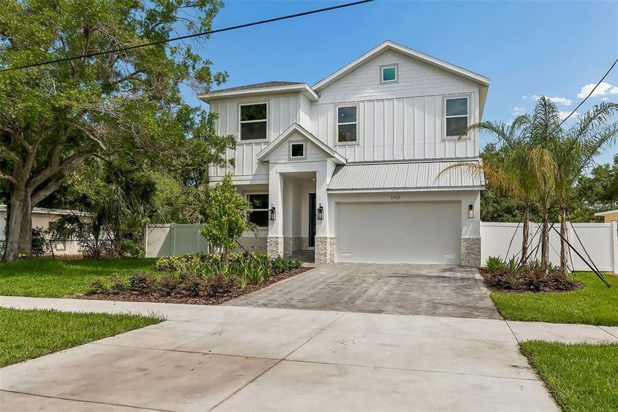 Front exterior of a new home in , Tampa, FL, highlighting curb appeal (Image 30).