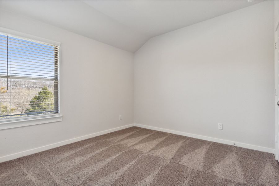 Bedroom in the Mesquite home plan by Trophy Signature Homes – REPRESENTATIVE PHOTO