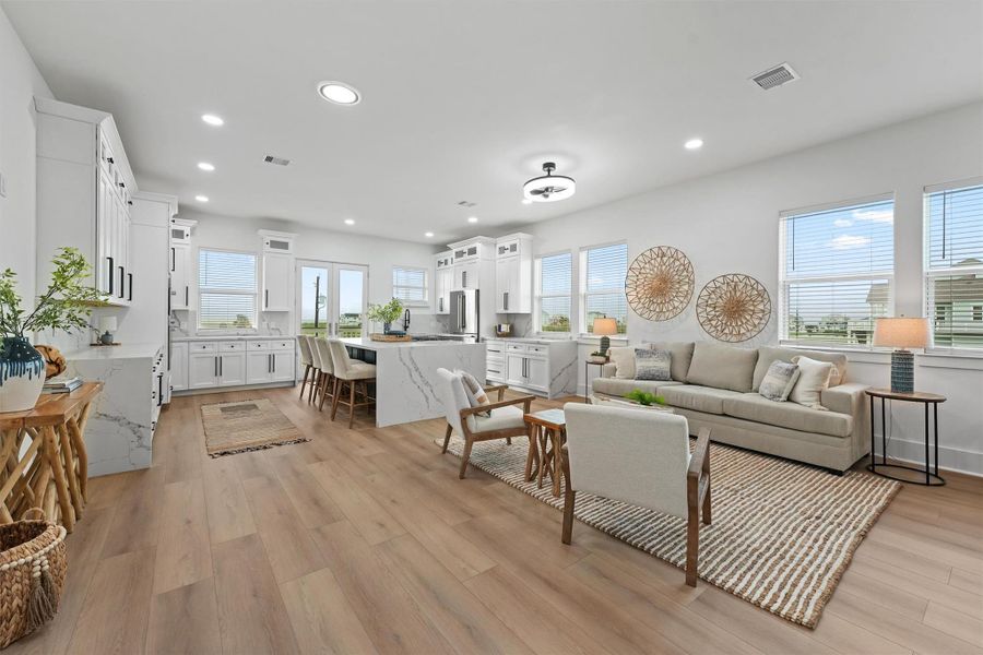 Spacious and inviting, the open-concept living room is filled with natural light and seamless access to expansive outdoor decks. Spacious and inviting, the open-concept living room is filled with natural light and seamless access to expansive outdoor decks.