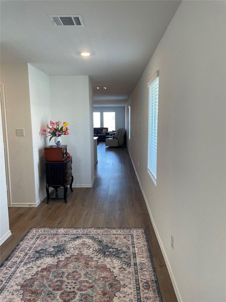 Hallway featuring dark wood-style floors and recessed lighting