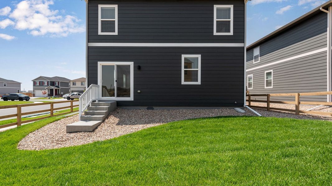 Exterior details and patio area of a home in Prairie Song, Windsor (Image 20).