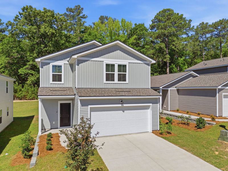Front exterior of a new home in Grand Arbor, Blythewood, SC, highlighting curb appeal (Image 2). Front exterior of a new home in Grand Arbor, Blythewood, SC, highlighting curb appeal (Image 2).