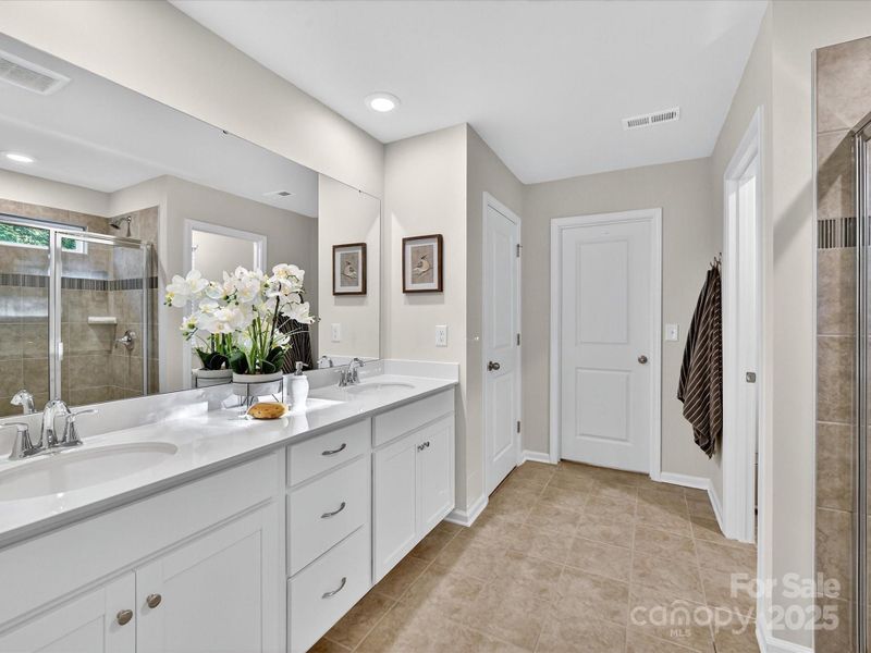Primary Shower with Tiled Surround and Bench Seat. Tiled Flooring