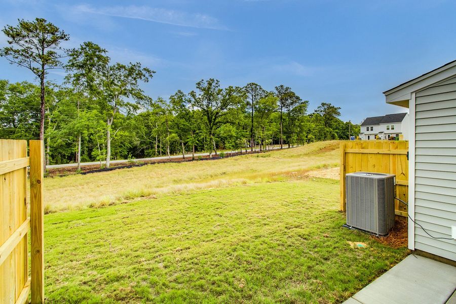 Exterior details and patio area of a home in Padgett Commons, Hopkins (Image 4).
