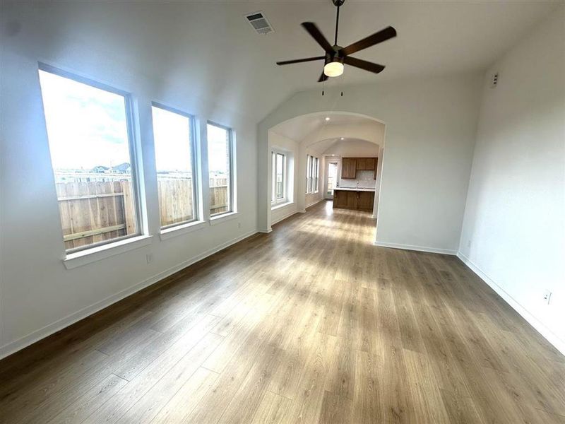 Family room is light and bright with tons of windows and open airy layout.