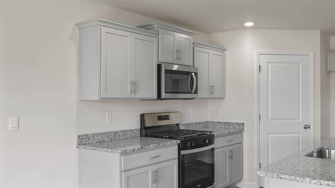 Furnished interior view inside a new home in Bentley Park, Greenwood (Image 8).
