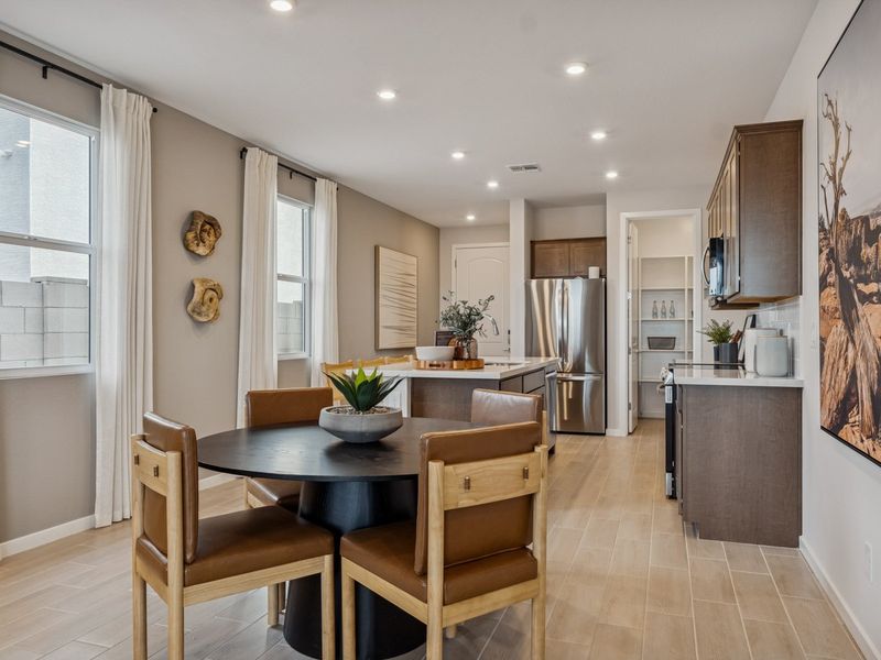 A kitchen with a dining table.