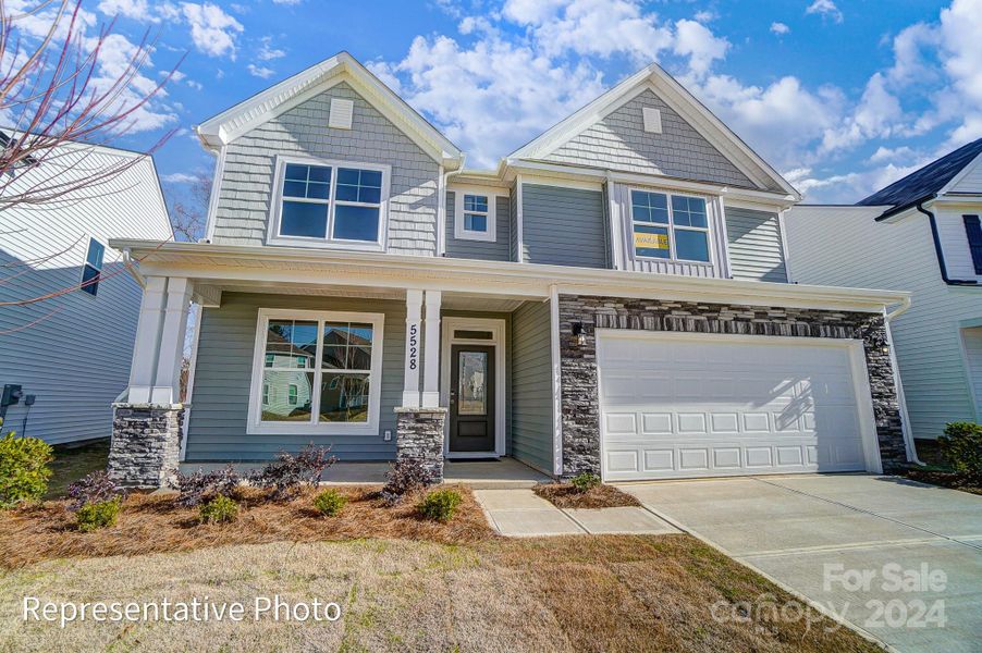 Homesite 50 features a Davidson C floorplan with front-load garage.