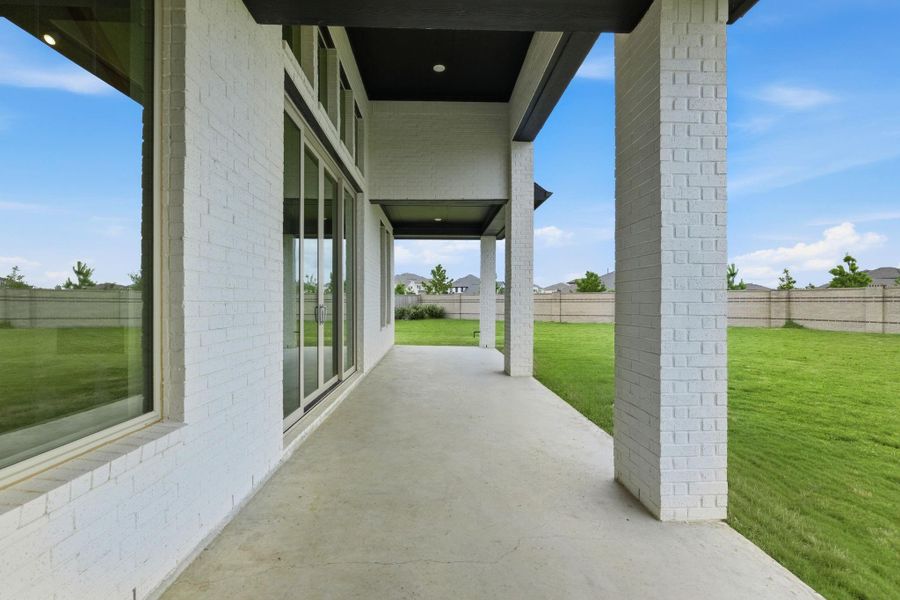 Covered porch and large backyard