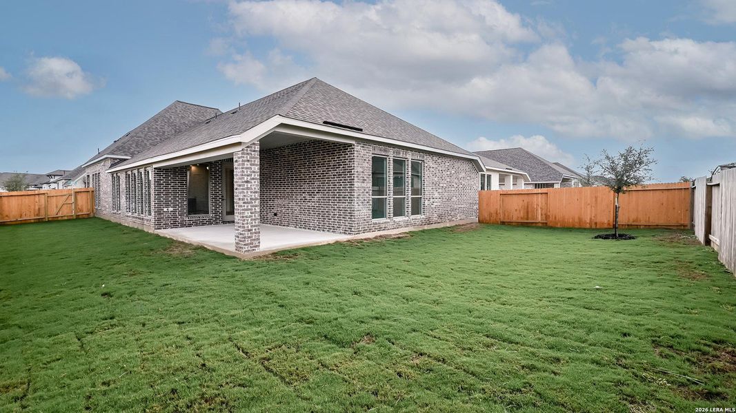 Exterior details and patio area of a home in Meadows of Mill Creek, Seguin (Image 22).