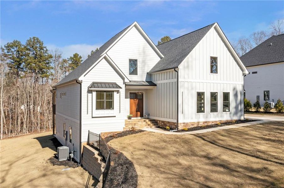 Front exterior of a new home in , Cumming, GA, highlighting curb appeal (Image 24).