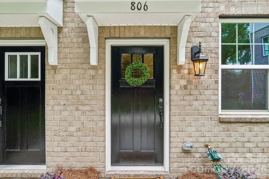 Exterior details and patio area of a home in Anderson Street Townhomes, Charlotte (Image 3).