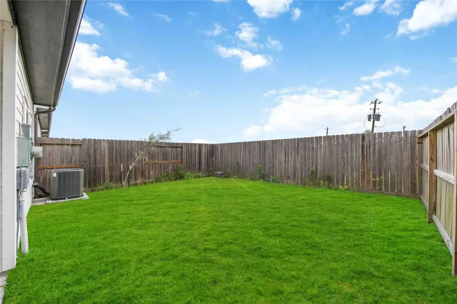 Large backyard with plenty of space for entertaining or relaxing