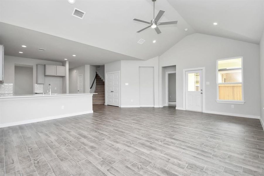 Take another glimpse into the heart of the home with this additional view of the family room—a sprawling space ready to accommodate all your gatherings. Sample photo of completed home with same plan. Actual colors and selections may vary.