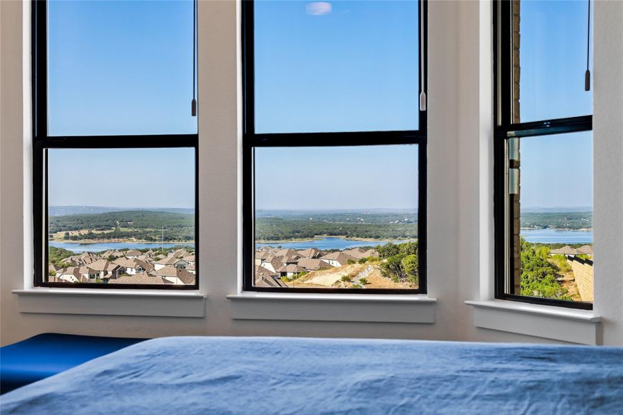 Large windows frame panoramic views of the water and surrounding hillsides. Large windows frame panoramic views of the water and surrounding hillsides.