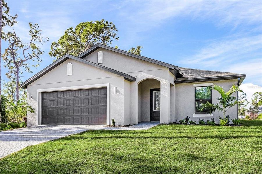 Front exterior of a new home in , North Port, FL, highlighting curb appeal (Image 2).