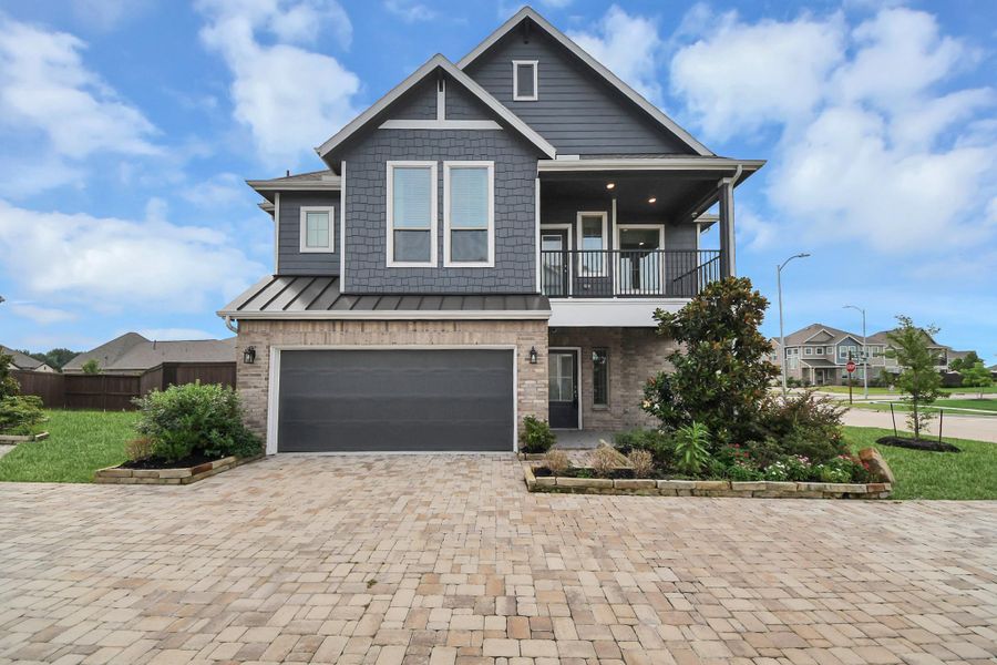 Front exterior of a new home in The Groves, Humble, TX, highlighting curb appeal (Image 27).