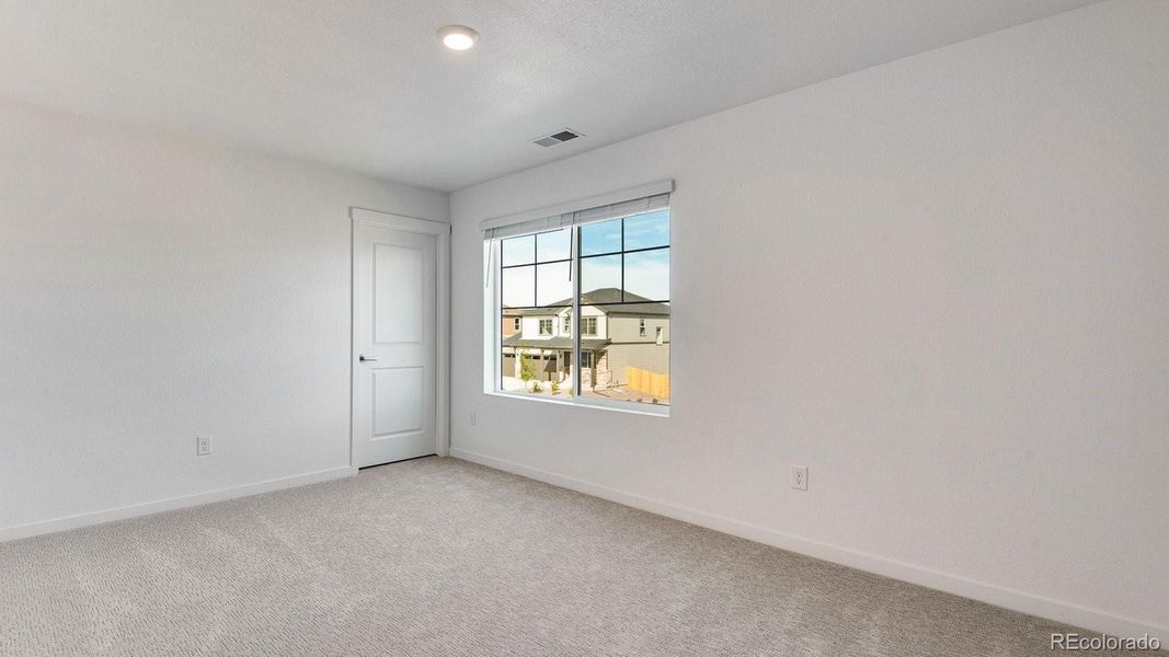 Spacious, unfurnished interior of a new home in Trails at Crowfoot, Parker (Image 36).