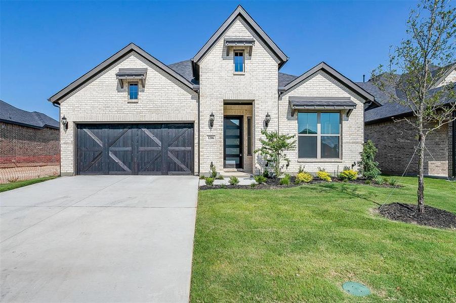 View of front of home featuring a front lawn