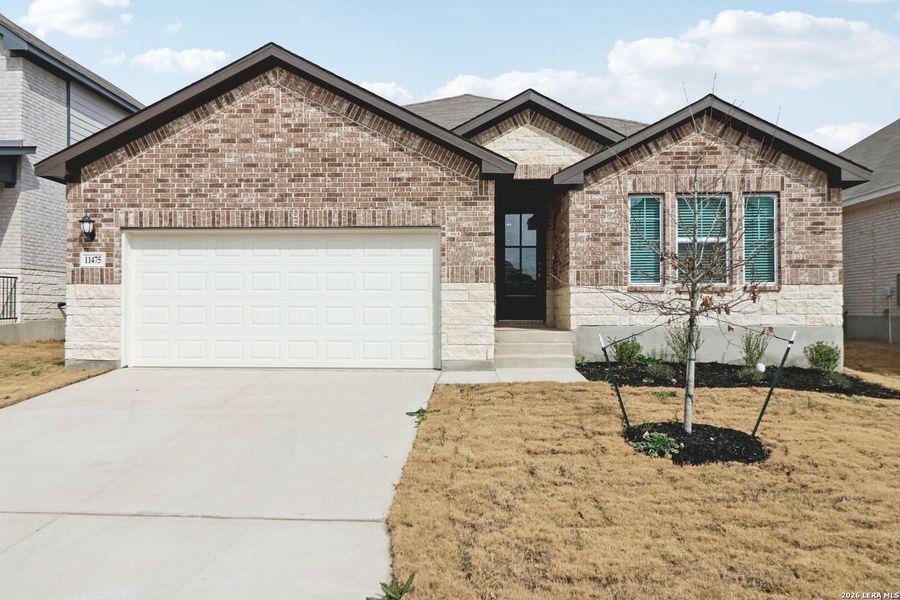 Front exterior of a new home in Sagebrooke - Classic Series, San Antonio, TX, highlighting curb appeal (Image 27).