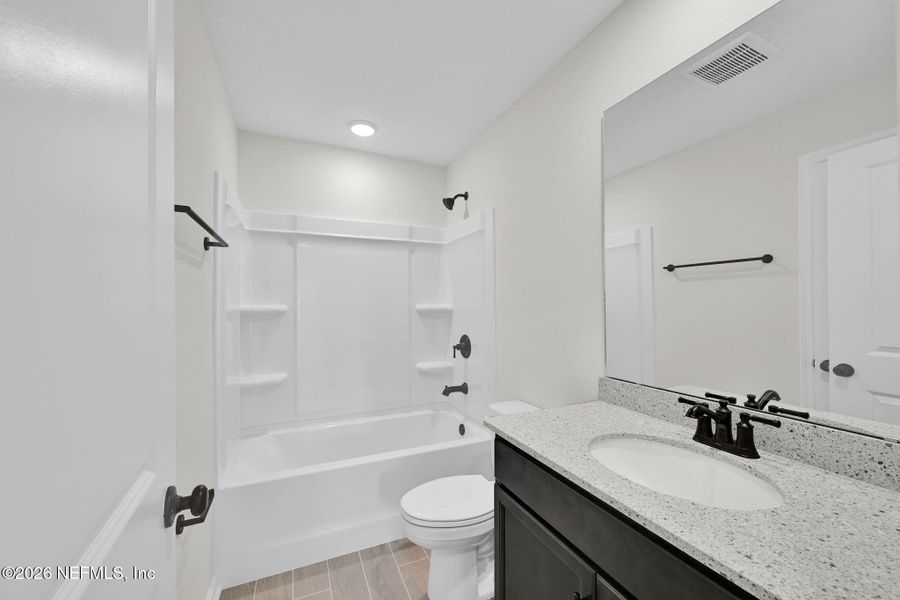 Furnished interior view inside a new home in Baxley Villas, Middleburg (Image 10).