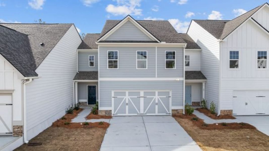 Front exterior of a new home in The Retreat at Browns Ridge, Newnan, GA, highlighting curb appeal (Image 3). Front exterior of a new home in The Retreat at Browns Ridge, Newnan, GA, highlighting curb appeal (Image 3).