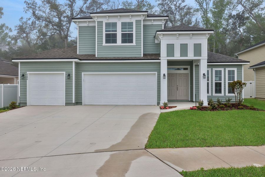 Front exterior of a new home in Jennings Farm, Middleburg, FL, highlighting curb appeal (Image 23). Front exterior of a new home in Jennings Farm, Middleburg, FL, highlighting curb appeal (Image 23).
