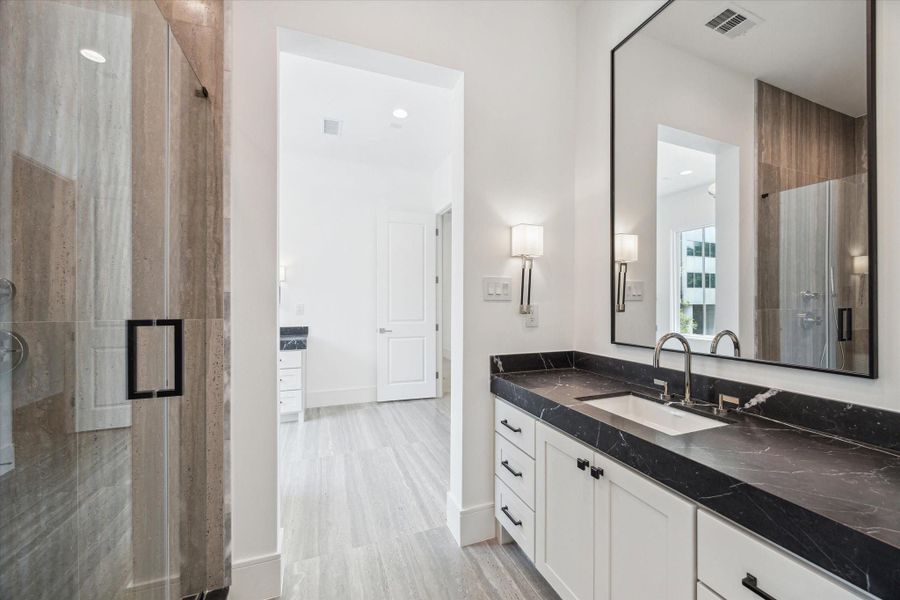 Second vanity space also has an oversized mirror and additional storage. Second vanity space also has an oversized mirror and additional storage.