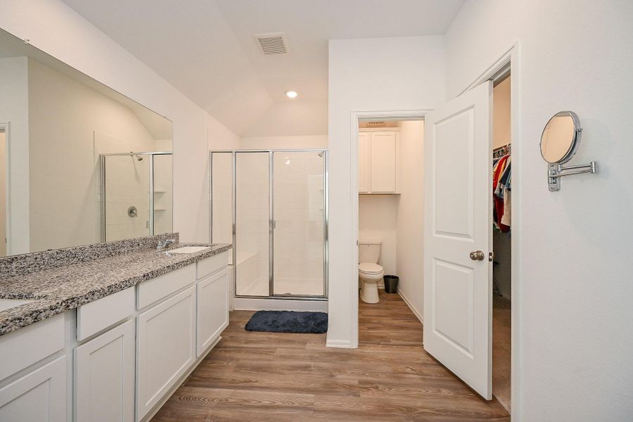 A full-width mirror above the vanity enhances the sense of space and reflects natural and recessed lighting, creating a clean, luminous atmosphere. A full-width mirror above the vanity enhances the sense of space and reflects natural and recessed lighting, creating a clean, luminous atmosphere.