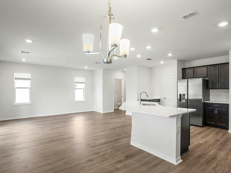 Your new home features a bright and welcoming open-concept living area - Seabrooke ll by Highland Homes