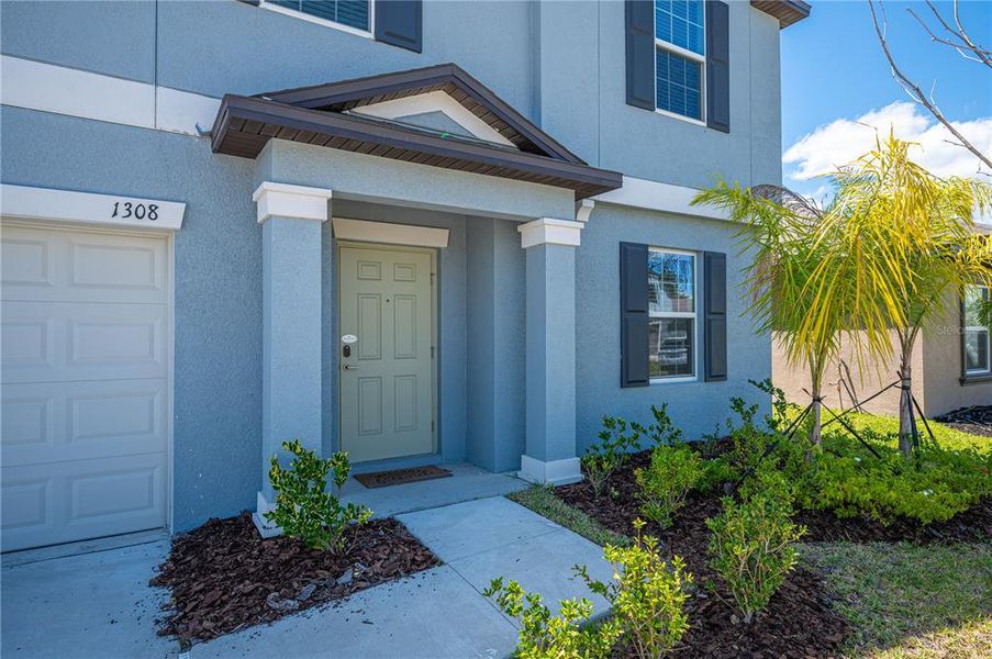 Front exterior of a new home in , Plant City, FL, highlighting curb appeal (Image 19).