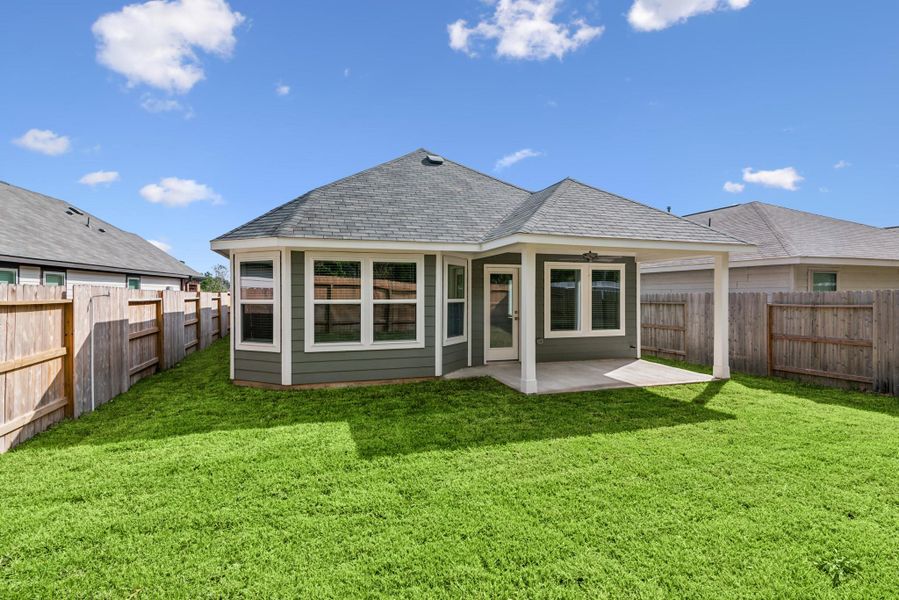 Exterior details and patio area of a home in Pinewood at Grand Texas, New Caney (Image 10).