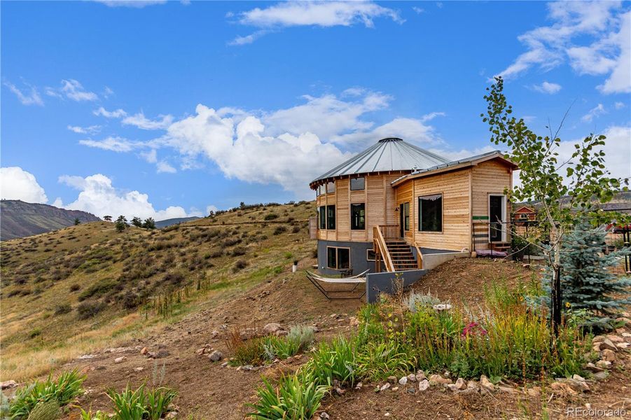 Front exterior of a new home in , Lyons, CO, highlighting curb appeal (Image 25).