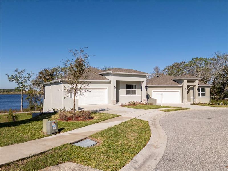 Front exterior of a new home in , Haines City, FL, highlighting curb appeal (Image 28). Front exterior of a new home in , Haines City, FL, highlighting curb appeal (Image 28).