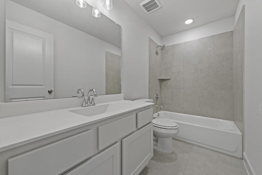 Furnished interior view inside a new home in Bridgeland, Cypress (Image 13).